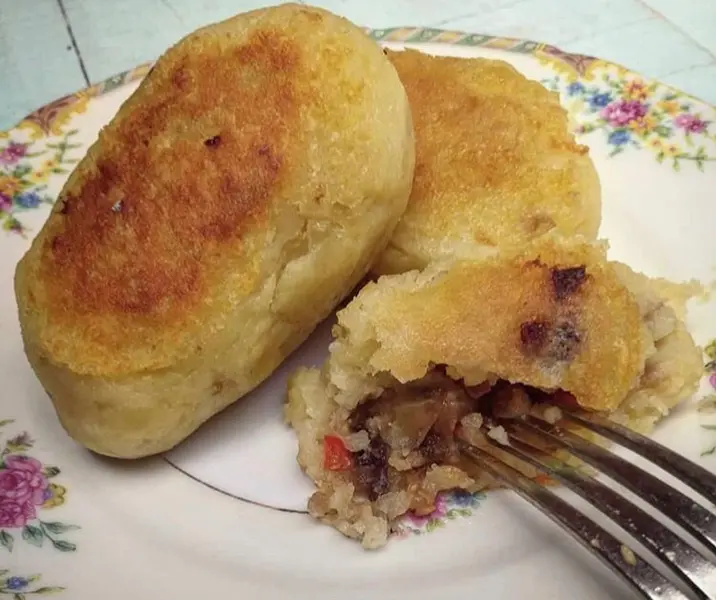 Papas rellenas con pino de berenjenas