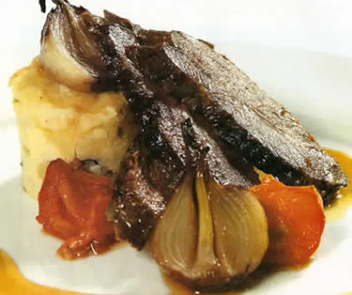 Punta de ganso al horno con puré de papas